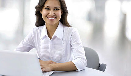 picture of a woman and her laptop