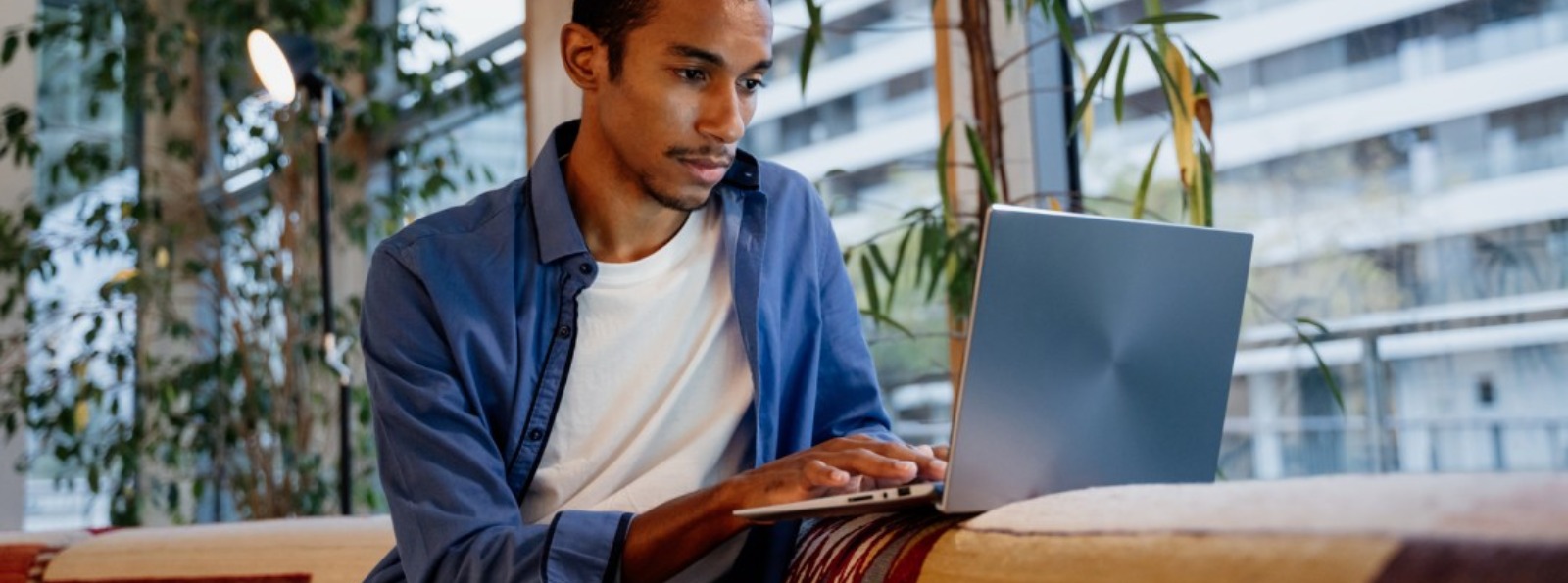 a man working on his laptop computer