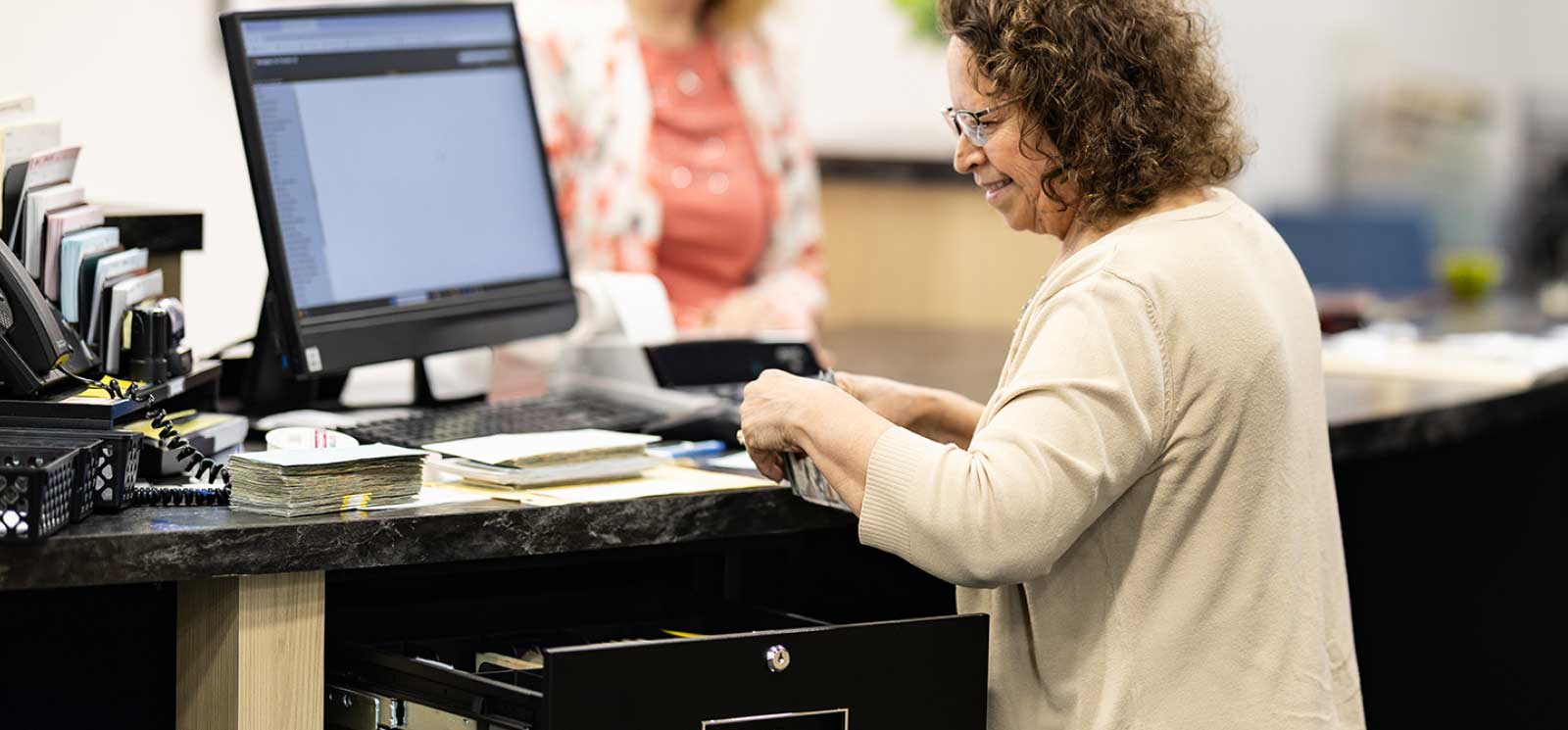 A Mediapolis Savings Bank employee serving a customer