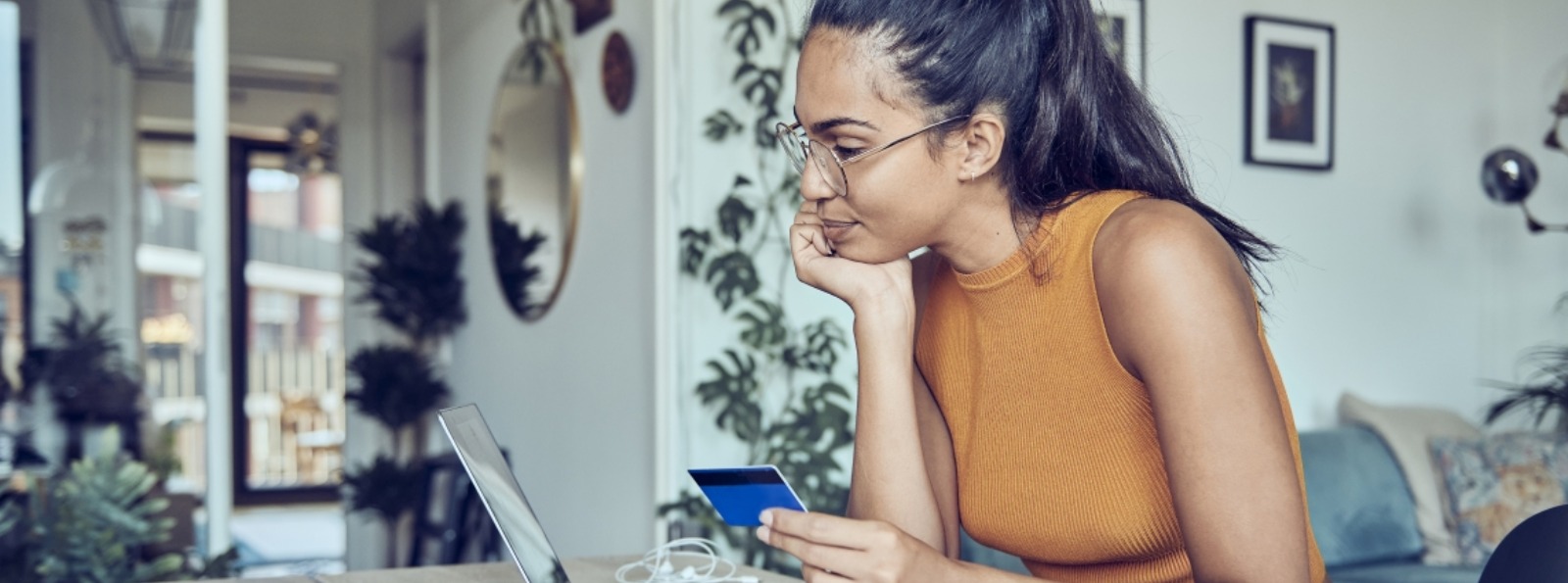 a woman making an online debit/credit purchase