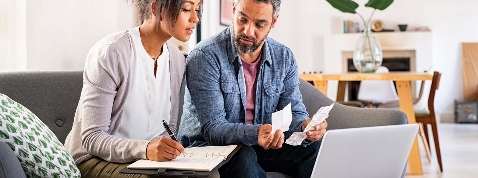 a couple calculating receipts