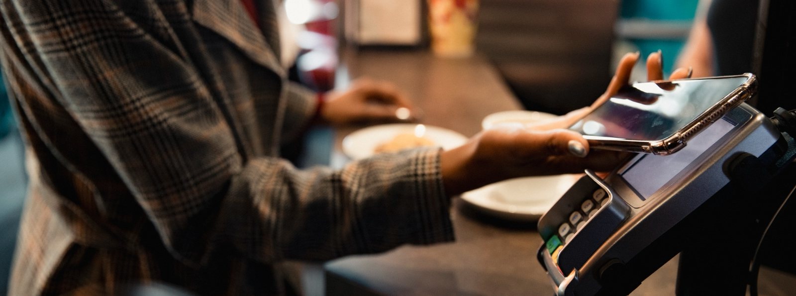 a person making a purchase using their mobile phone