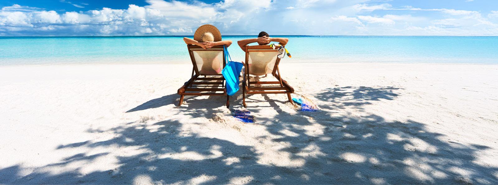 a couple relaxing on a beach