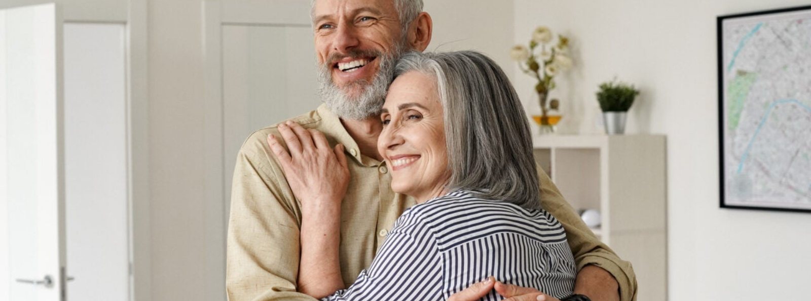 an elderly couple embracing